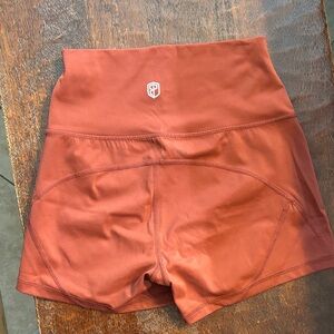 Born Primitive High-Waisted Athletic Shorts in Rust